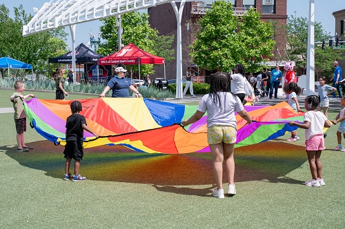 children playing with parachute